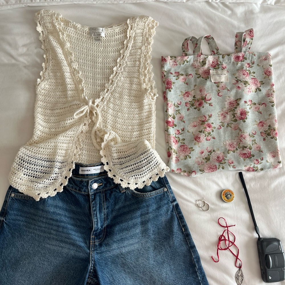 Beautiful crotchet style  vest with little bow in the front